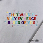 Flat lay of a funny academic gift embroidered pullover sweatshirt for science and data lovers.
