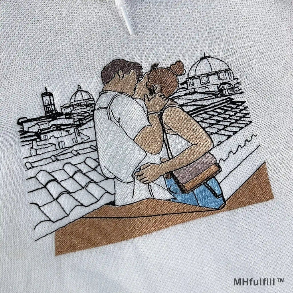 High quality embroidery texture of a couple photo stitched on a cozy premium white hoodie.
