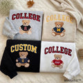 Four colorful custom college teddy bear embroidered sweatshirts flatlay by MHfulfill