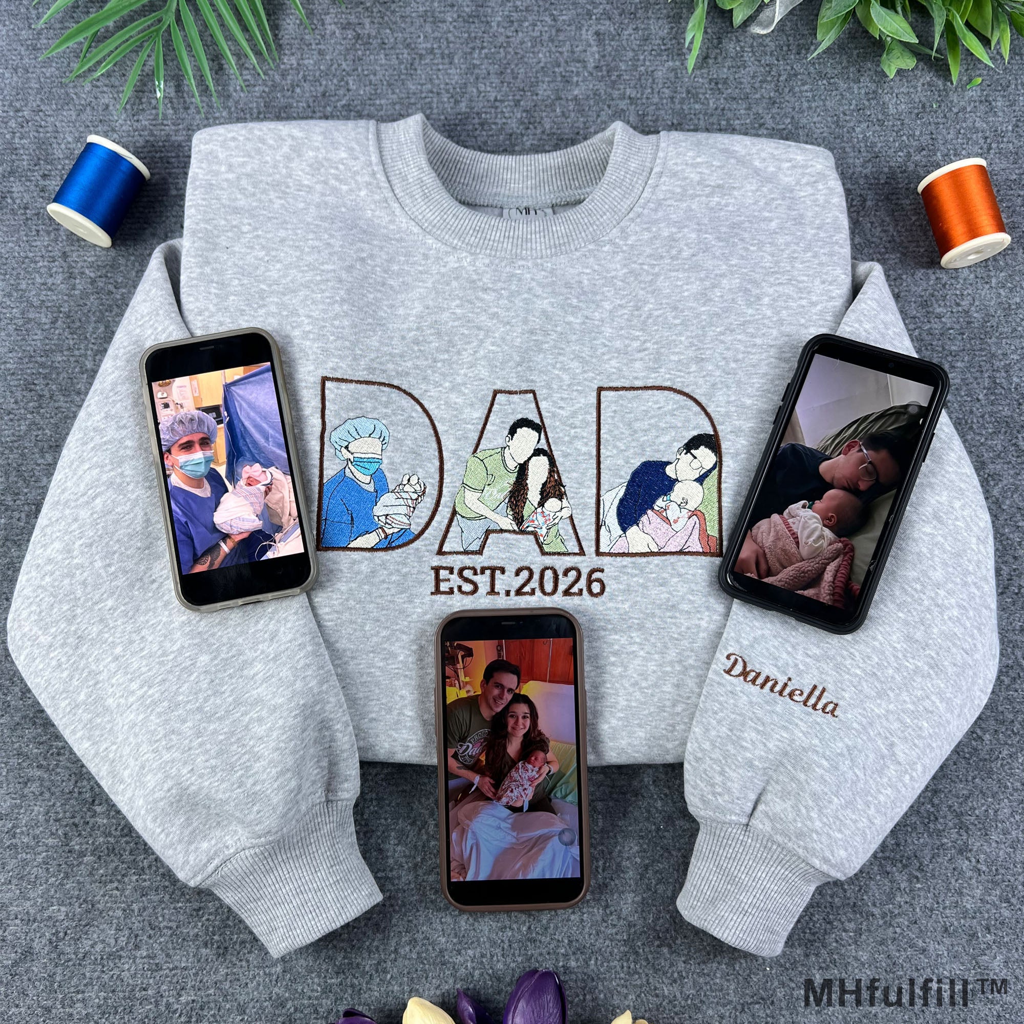Custom dad photo outline embroidered sweatshirt in grey featuring personalized Father's Day design and phones displaying reference family photos.