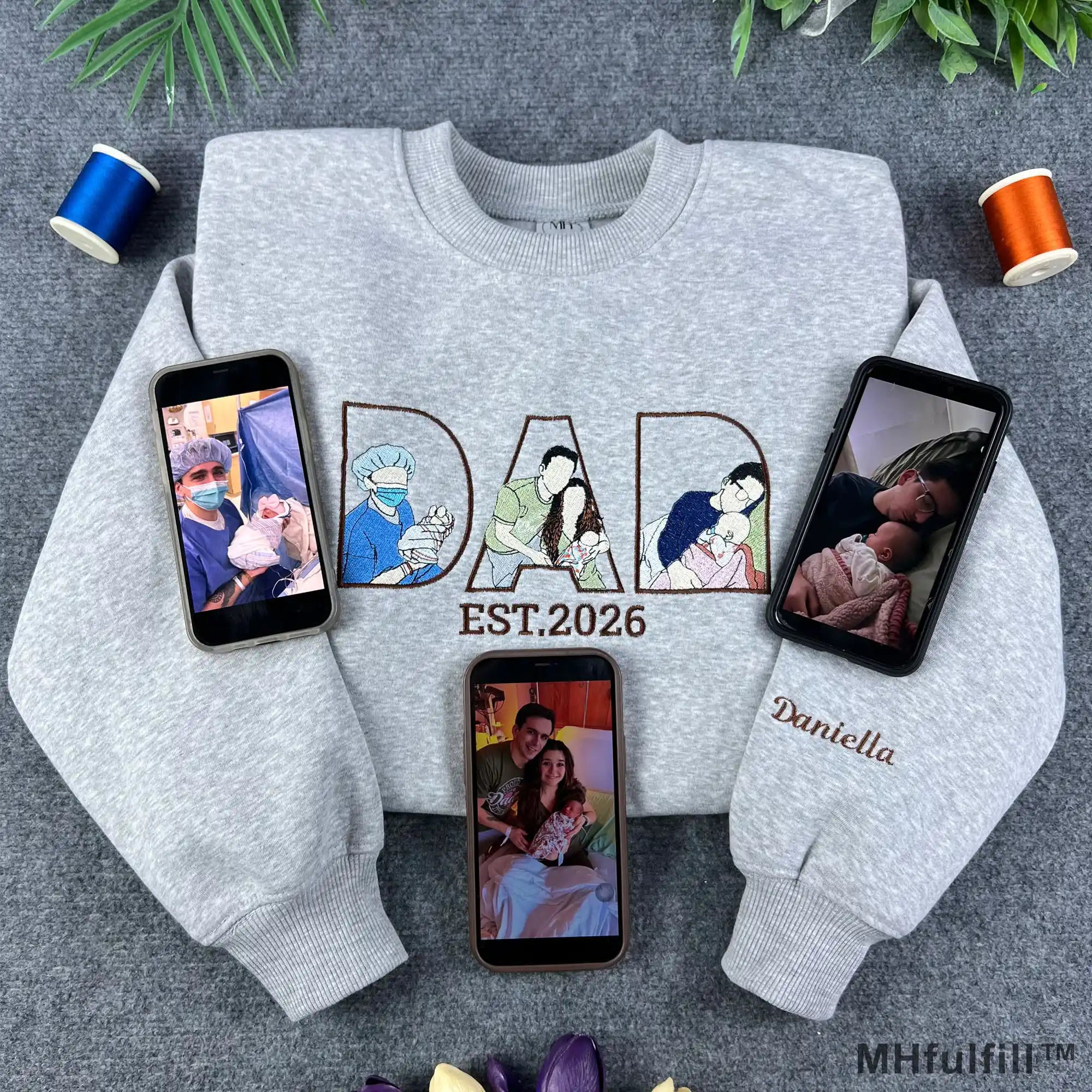 Custom dad photo outline embroidered sweatshirt in grey featuring personalized Father's Day design and phones displaying reference family photos.