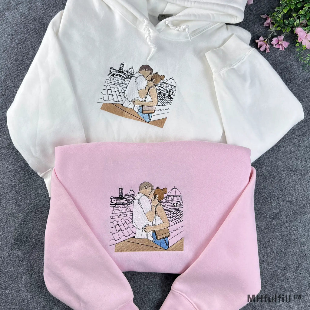 Custom embroidered couple photo hoodie in white featuring a romantic stitched line art design.