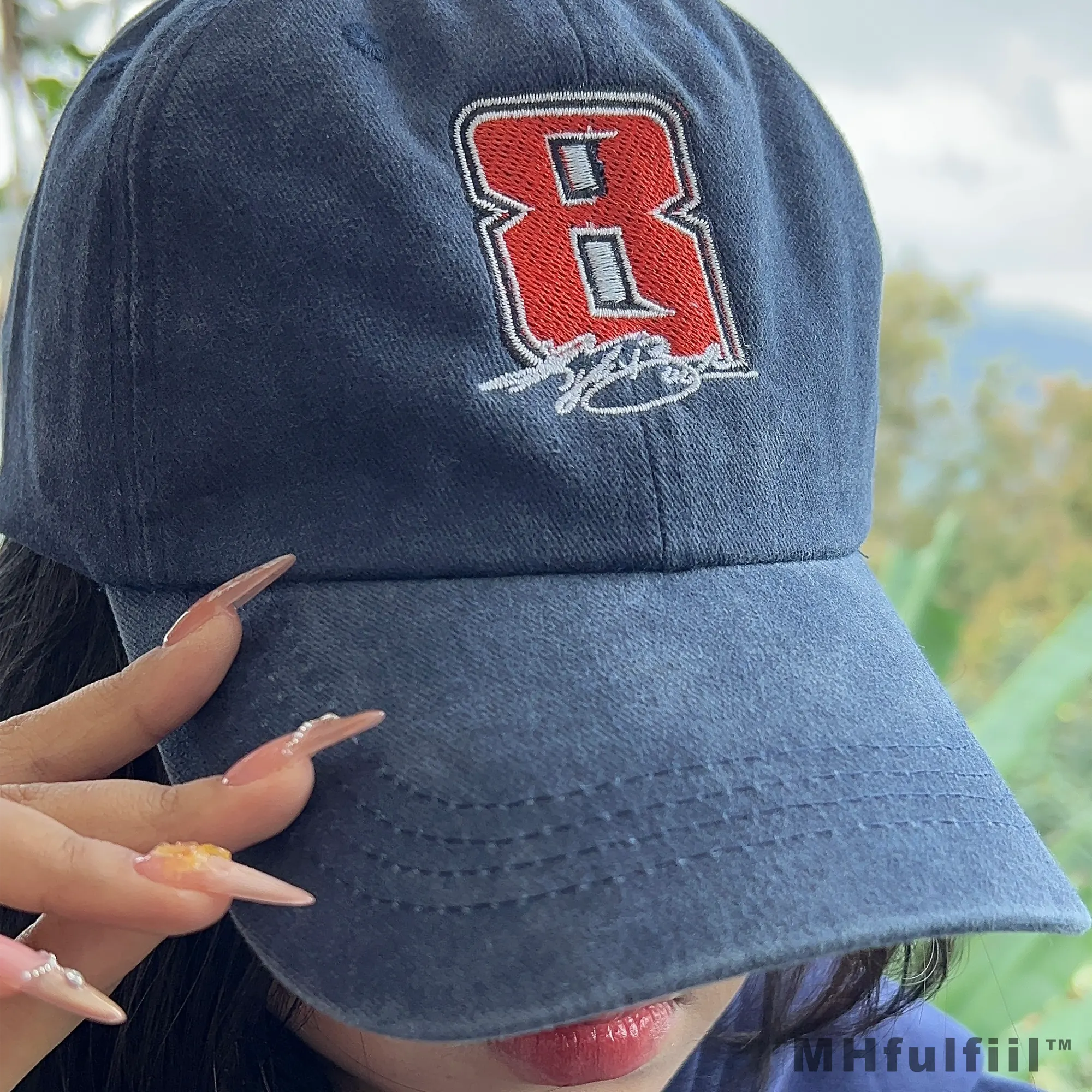 Black custom embroidered dad hat with high-quality personalized text stitching.
