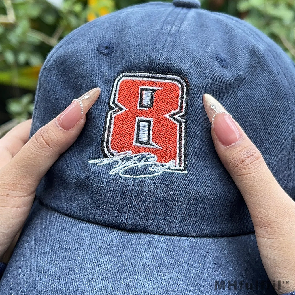 Young man wearing a vintage custom embroidered hat in a casual urban streetwear style.