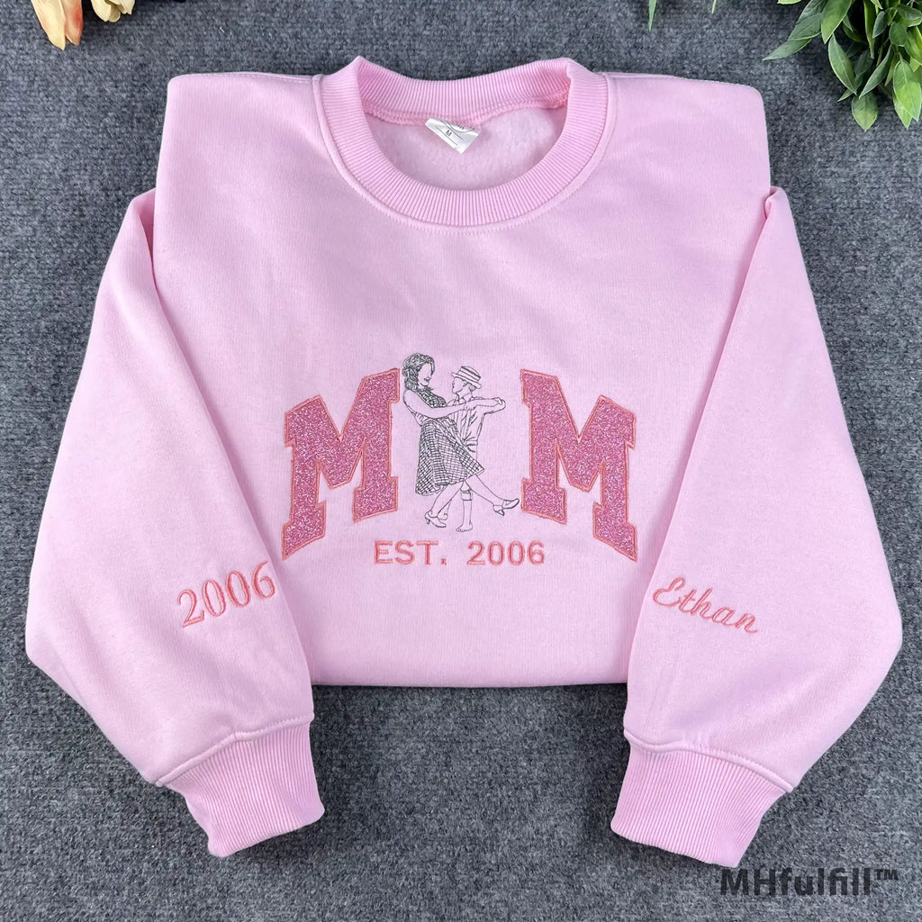 Custom Mom line art embroidered sweatshirt in pastel pink color featuring glitter applique lettering.