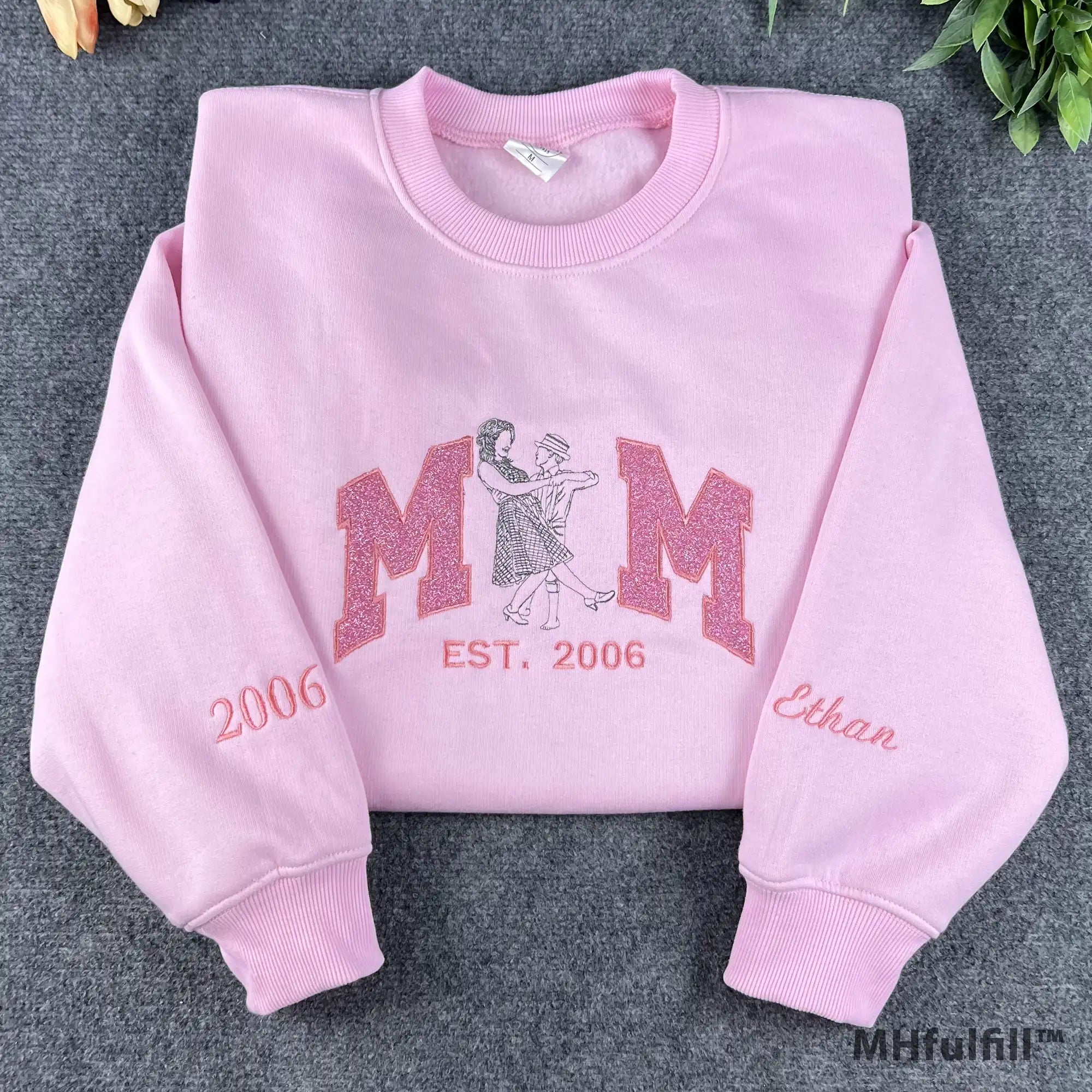 Custom Mom line art embroidered sweatshirt in pastel pink color featuring glitter applique lettering.