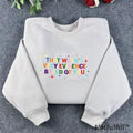 Front view of a premium embroidered science meme crewneck with rainbow letters and star sparkles details.
