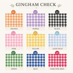 A color swatch chart titled 'GININGHAM CHECK' showing nine gingham pattern options in orange, purple, black, pink, yellow, light blue, green, blue, and dark pink, each labeled with a number and name on a cream background.