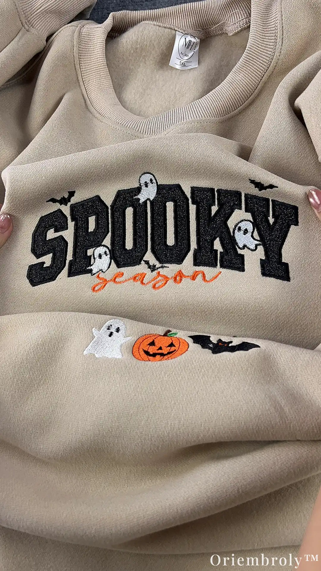 Close-up of embroidered ghost and Spooky Season lettering
