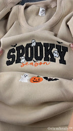 Close-up of embroidered ghost and Spooky Season lettering