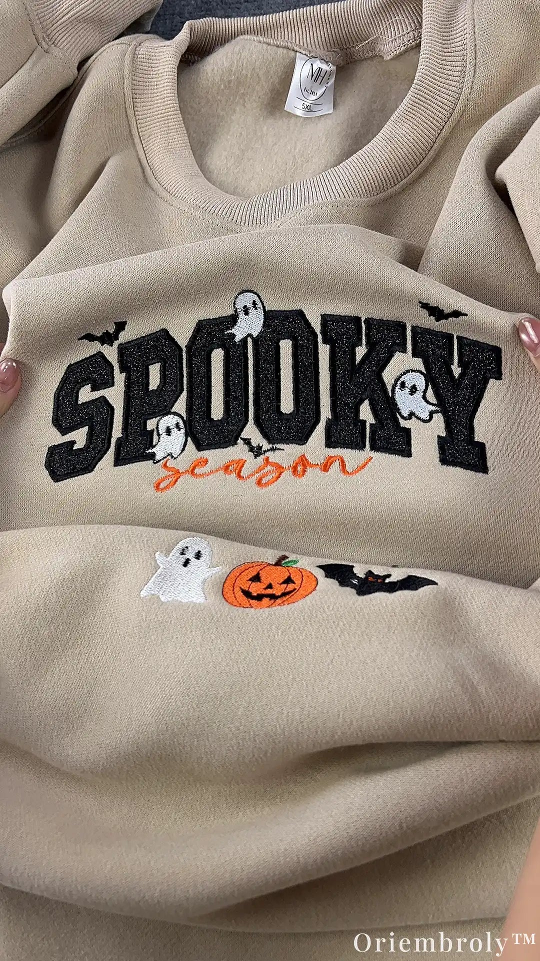 Close-up of embroidered ghost and Spooky Season lettering