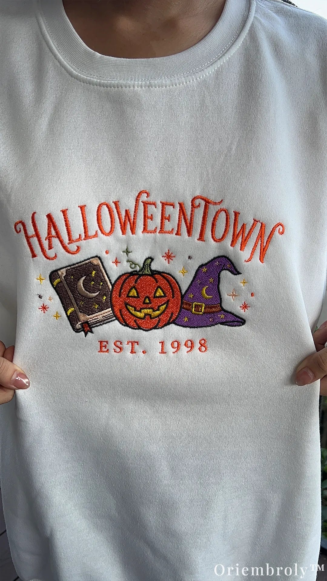 HALLOWEENTOWN embroidered crewneck sweatshirt with spellbook and pumpkin