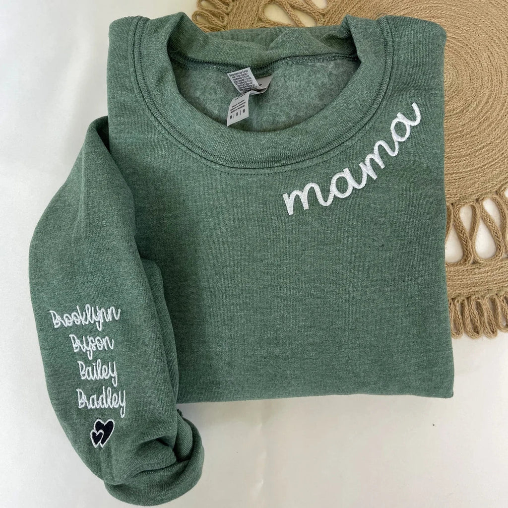 Mama embroidered sweatshirt in green featuring custom names on the sleeve.