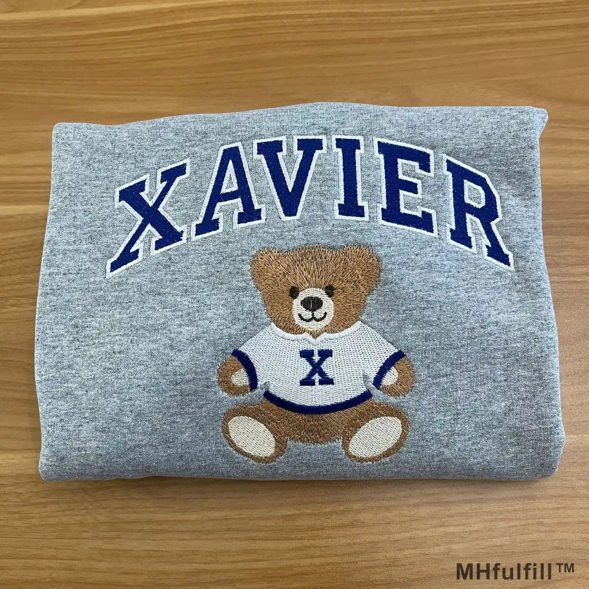 Close up of premium high density embroidery stitching on MHfulfill custom bear sweatshirt