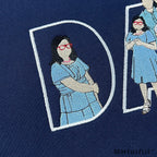 Close-up of premium custom embroidered portrait lines inside DAD lettering on a sweatshirt by MHfulfill.