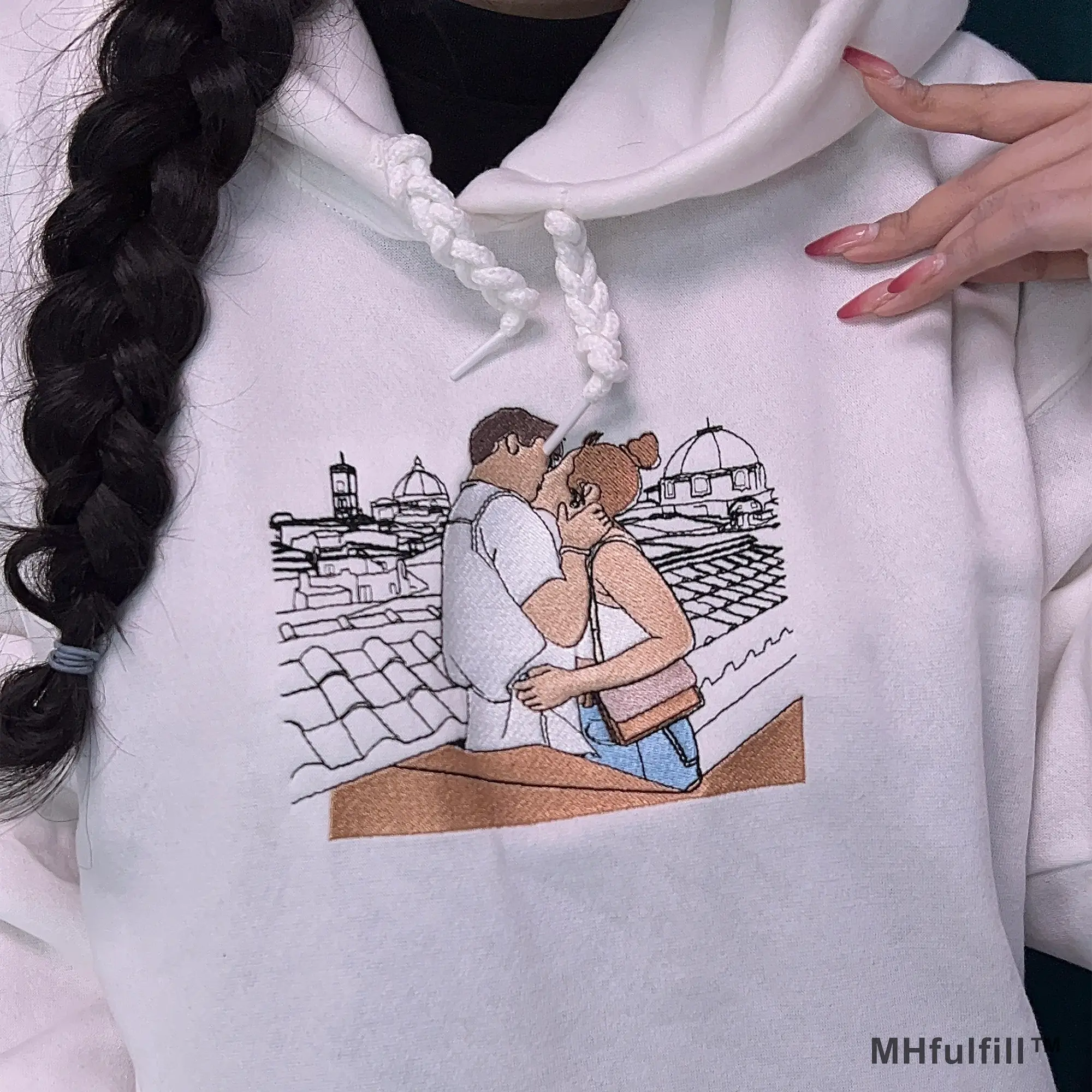 Soft fleece interior and premium cuff details of an oversized custom photo stitch hoodie.