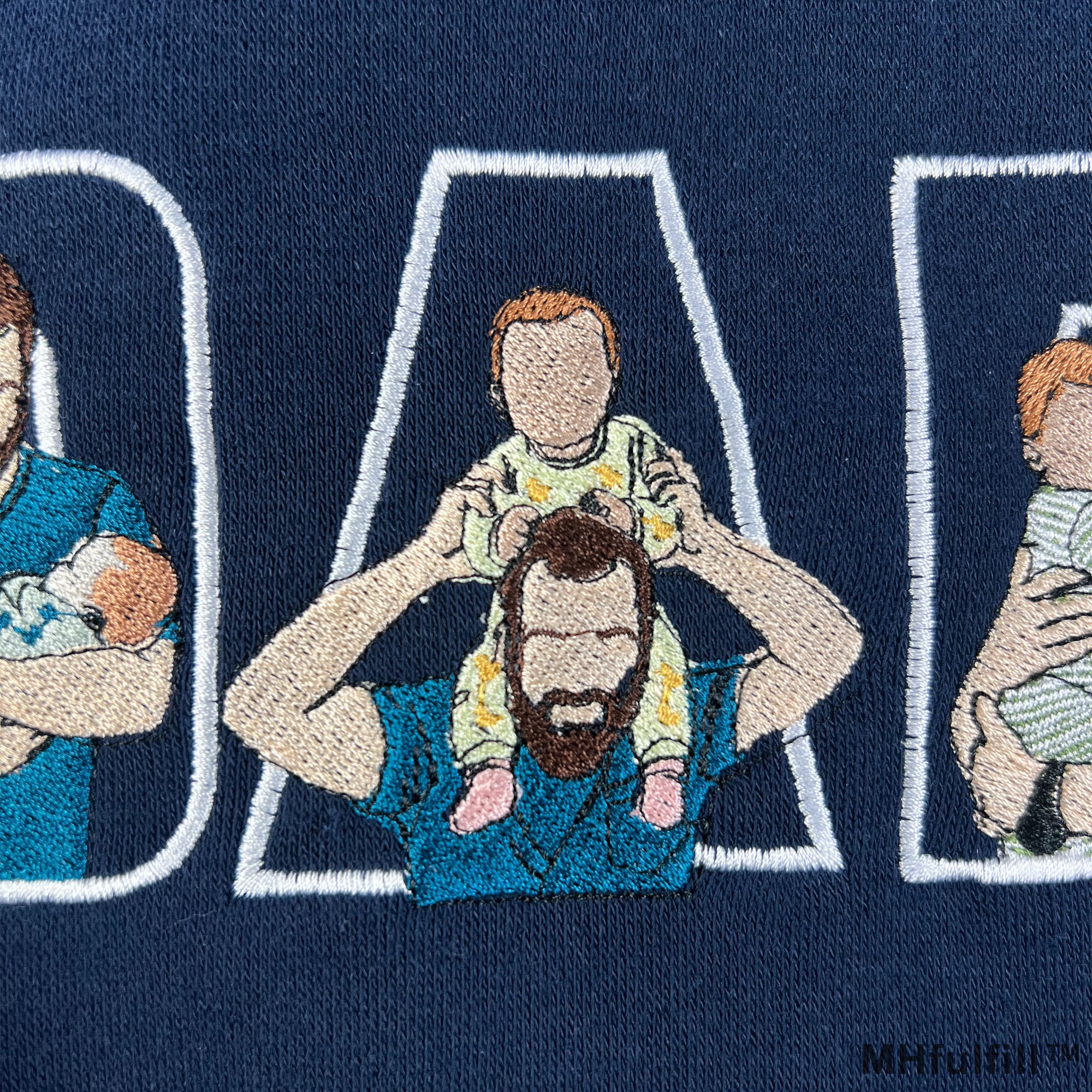 Personalized dad sweatshirt with embroidered kids pictures inside DADA text block layout.