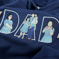 Personalized family photo converted into custom line art embroidery on a dark blue Father's Day hoodie.