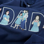 Personalized family photo converted into custom line art embroidery on a dark blue Father's Day hoodie.