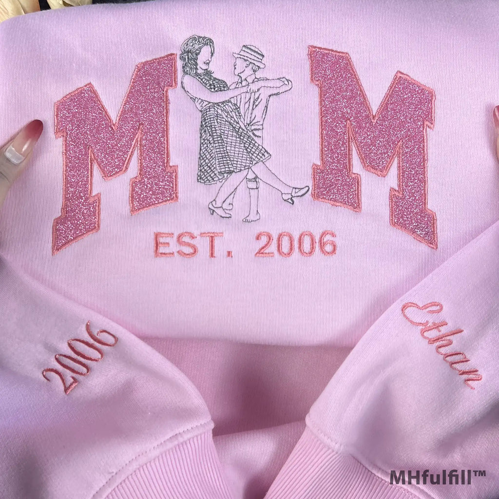 Close-up of personalized family photo transformed into line art embroidery on a crewneck sweater.