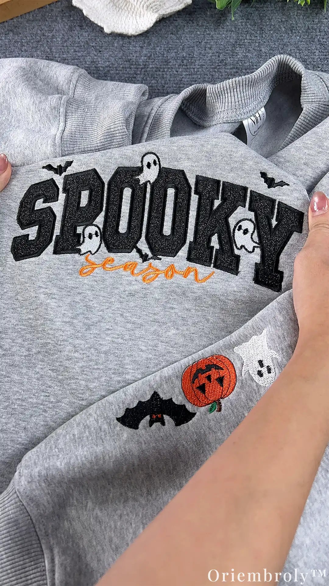 Playful Halloween embroidered sweatshirt with friendly ghosts