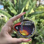 Project Hail Mary PVC patch attached to a military tactical backpack panel.