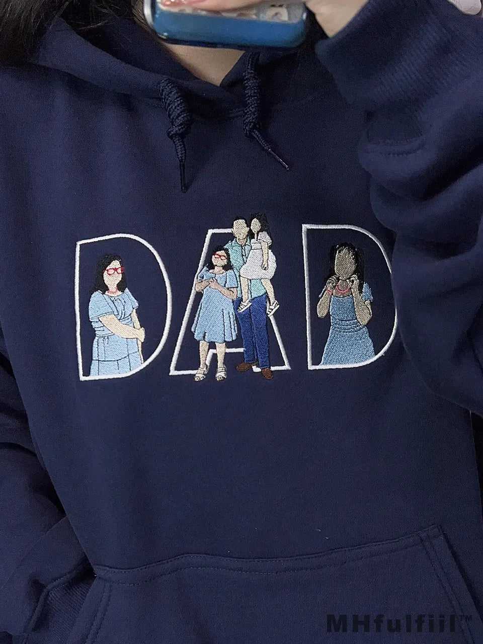 Custom embroidered navy blue hoodie featuring "DAD" text filled with a personalized family portrait outline.